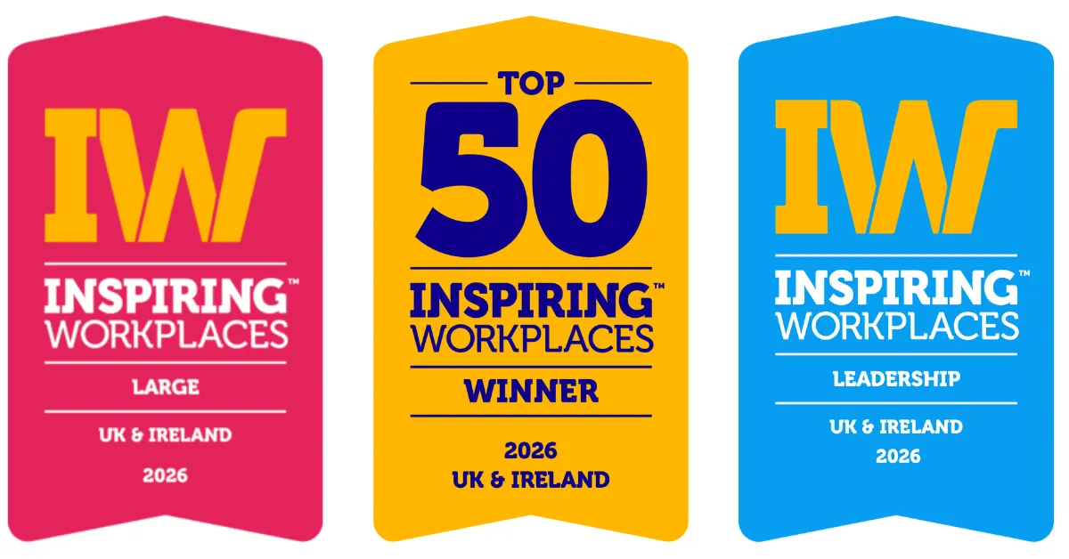 Set of three Inspiring Workplaces award ribbons in pink, yellow, and blue: left ribbon says LARGE, UK & IRELAND, 2026; middle reads TOP 50 WINNER, 2026 UK & IRELAND; right reads LEADERSHIP, UK & IRELAND, 2026.